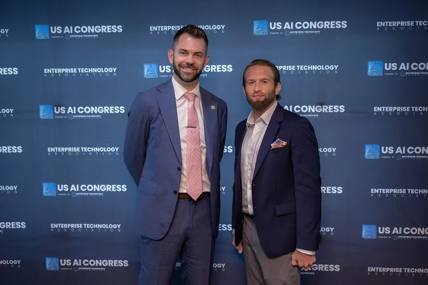 Zack Huhn at the US AI Congress step-and-repeat